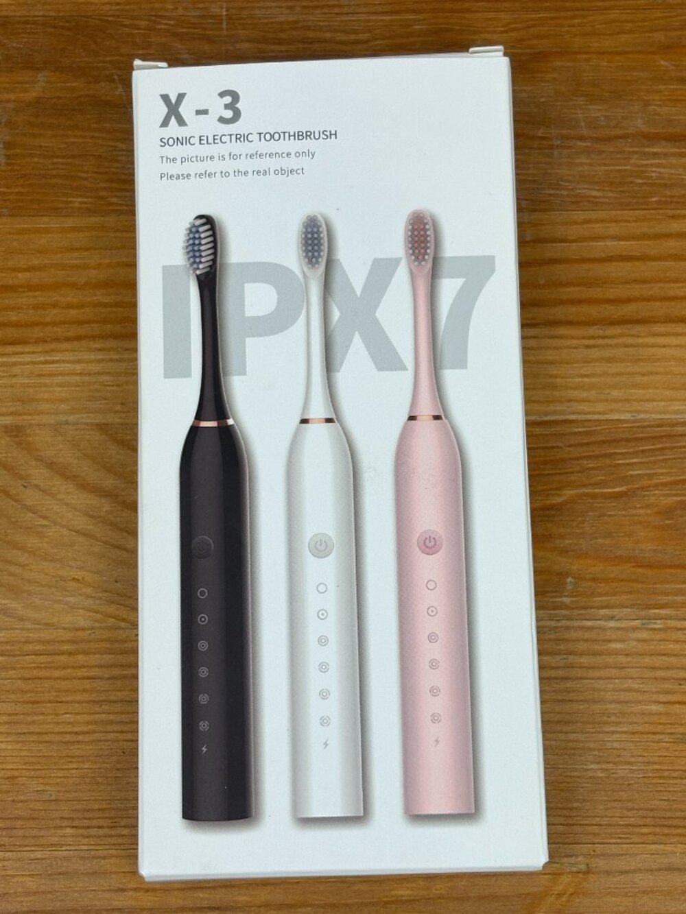 X-3 Sonic Electric Toothbrush in light pink with 4 toothbrush heads. New